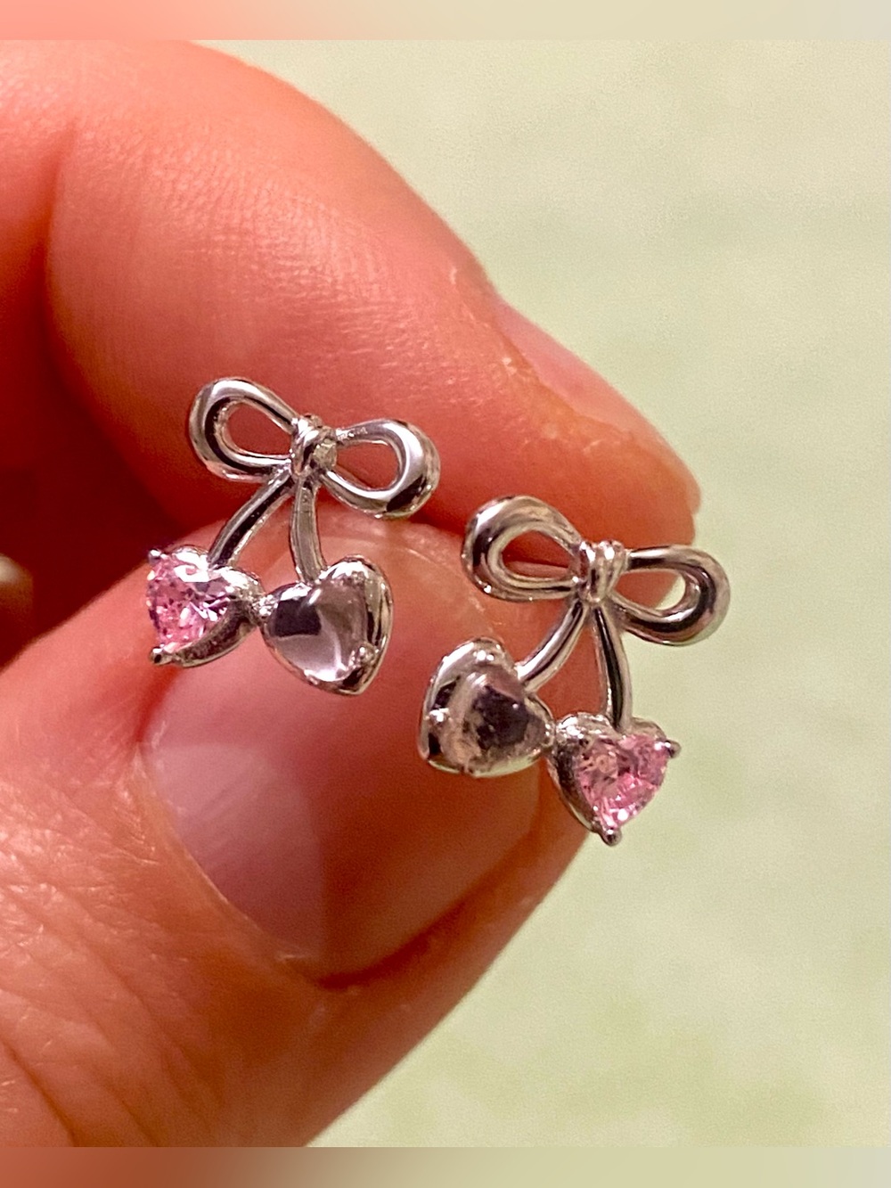 Silver Bow Cherry Stud Earrings with Pink Gem Accents
